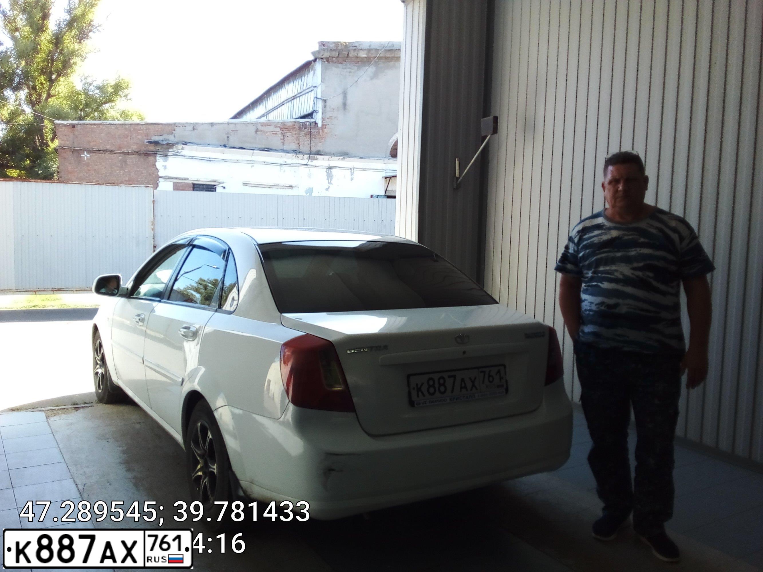 Фото автомобиля DAEWOO GENTRA, 2013 — госномер К887АХ761. Цвет: БЕЛО-ДЫМЧАТЫЙ