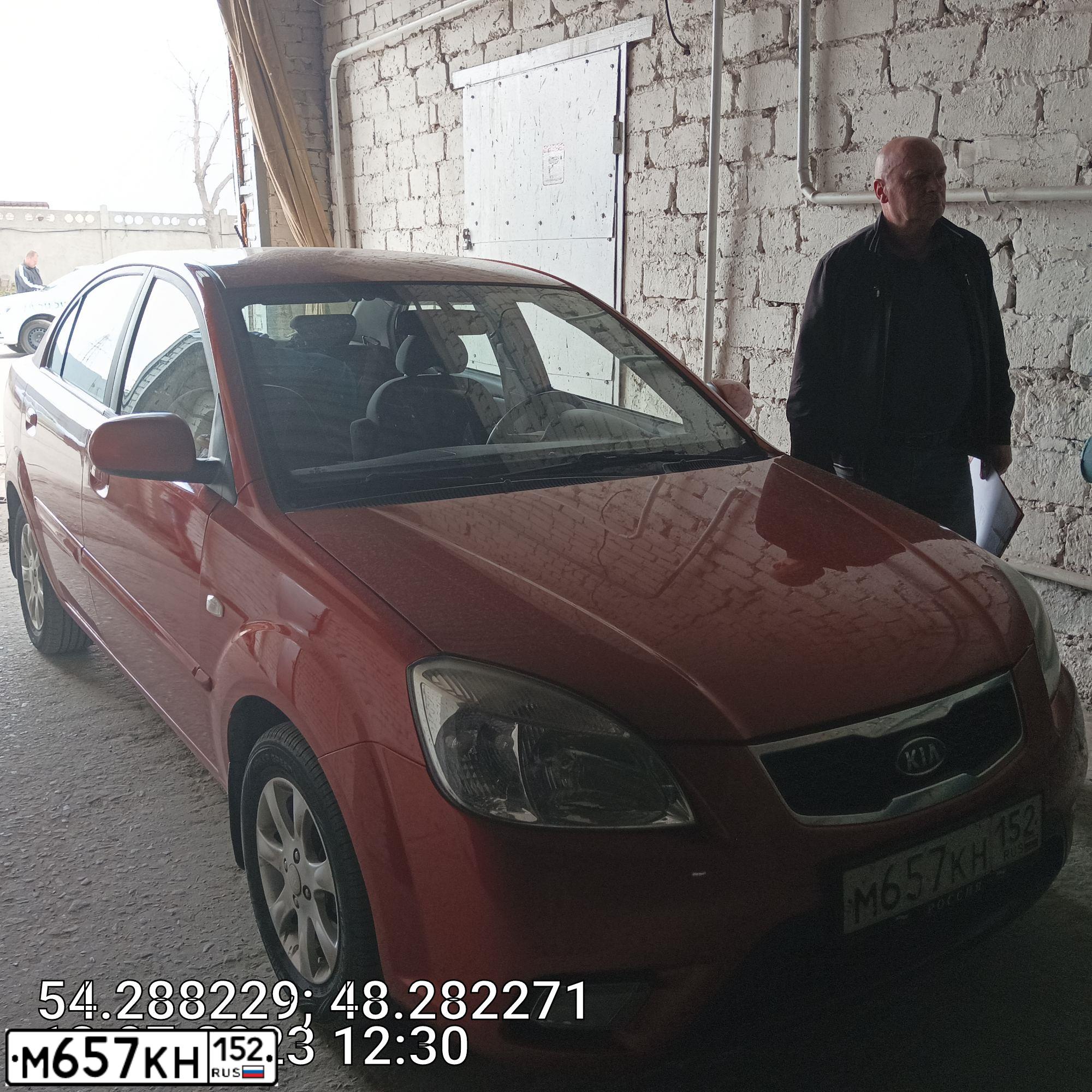 Фото автомобиля KIA RIO, 2010 — госномер Н747ТУ73. Цвет: Оранжевый