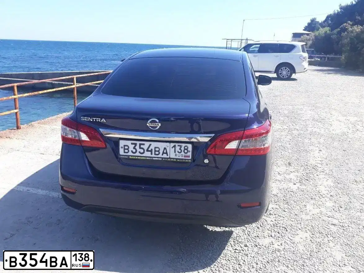 Фото автомобиля NISSAN SENTRA/LUCINO/, 2015 — госномер Е779КВ138. Цвет: синий