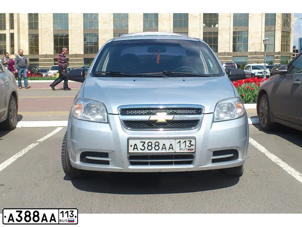 Фото автомобиля CHEVROLET AVEO, 2011 — госномер Н557АА13. Цвет: Серебристый