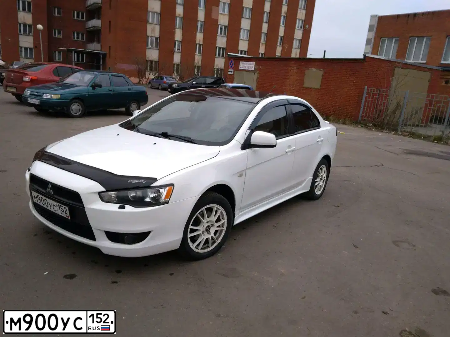 Фото автомобиля MITSUBISHI LANCER, 2008 — госномер К111ОН152. Цвет: Белый