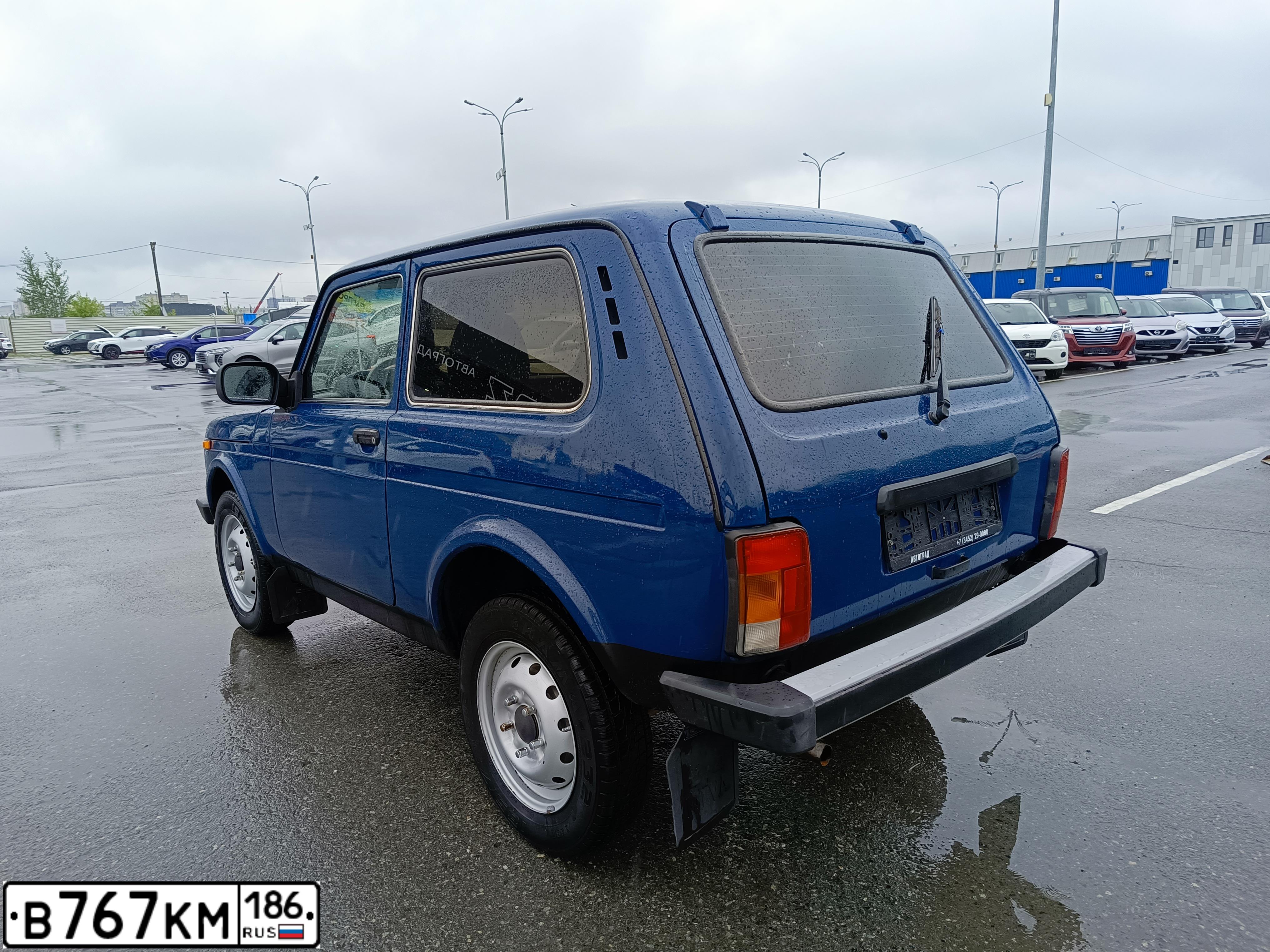 Фото автомобиля LADA 2121 NIVA, 2016 — госномер В767КМ186. Цвет: СИНЕ - ЗЕЛЕНЫЙ