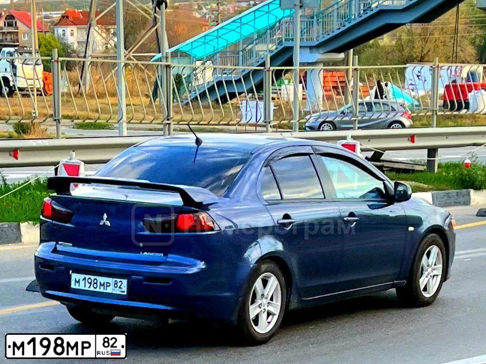 Фото автомобиля MITSUBISHI LANCER, 2011 — госномер М198МР82. Цвет: СИНИЙ