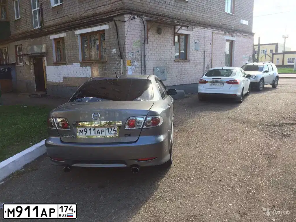 Фото автомобиля MAZDA 6, 2003 — госномер М911АР174. Цвет: ТЕМНО-СЕРЫЙ