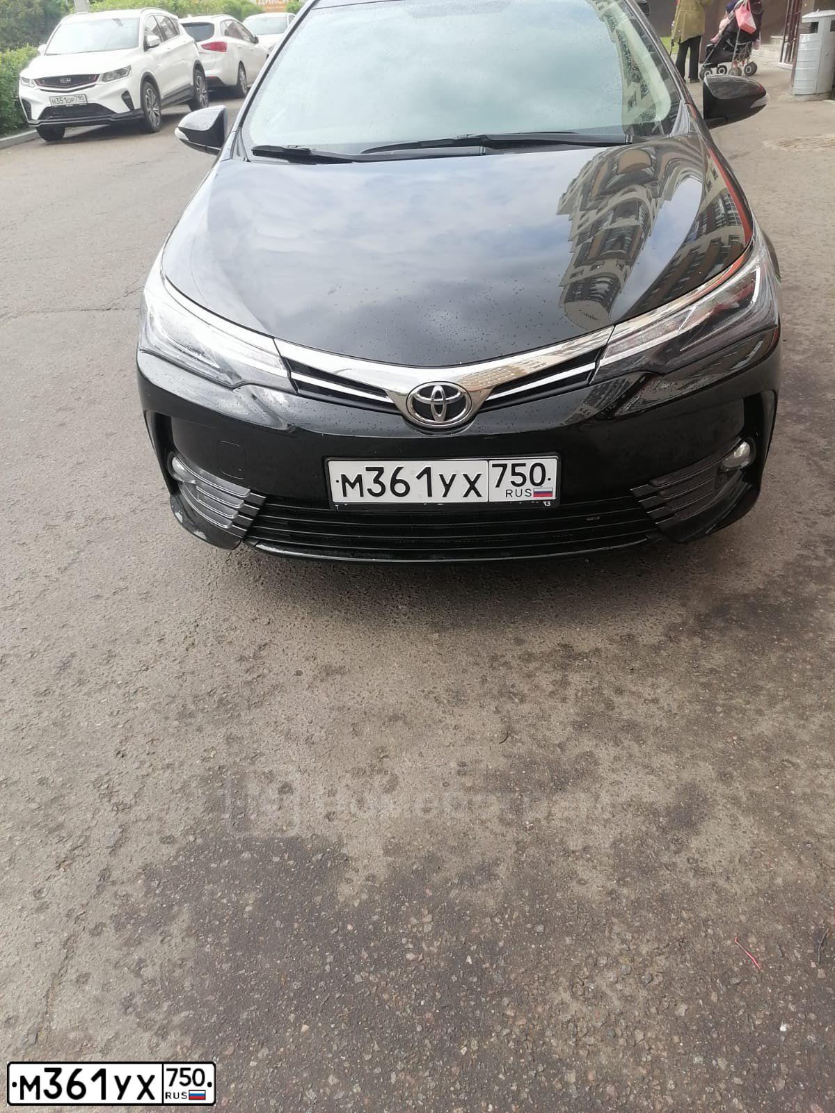 Фото автомобиля TOYOTA COROLLA, 2016 — госномер К323УЕ150. Цвет: ЧЕРНЫЙ