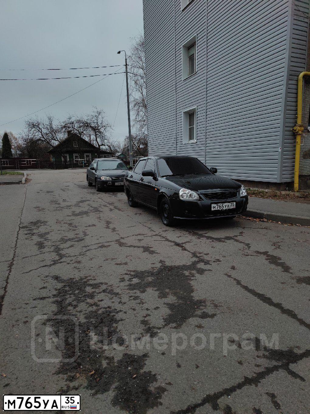 Фото автомобиля LADA 2170 PRIORA, 2007 — госномер М765УА35. Цвет: СИНЕ-ЧЕРНЫЙ