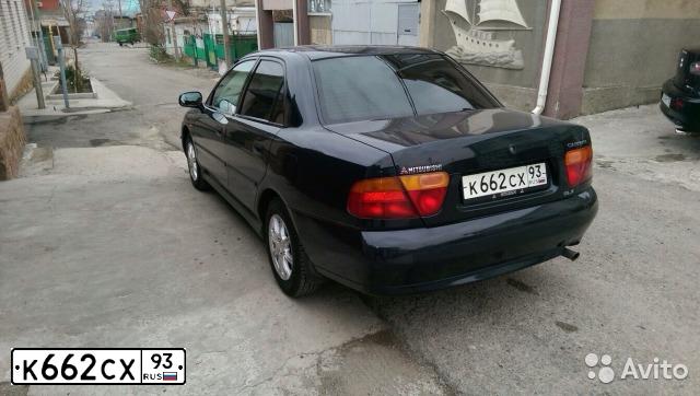 Фото автомобиля MITSUBISHI CARISMA, 1998 — госномер К662СХ93. Цвет: ЧЕРНЫЙ