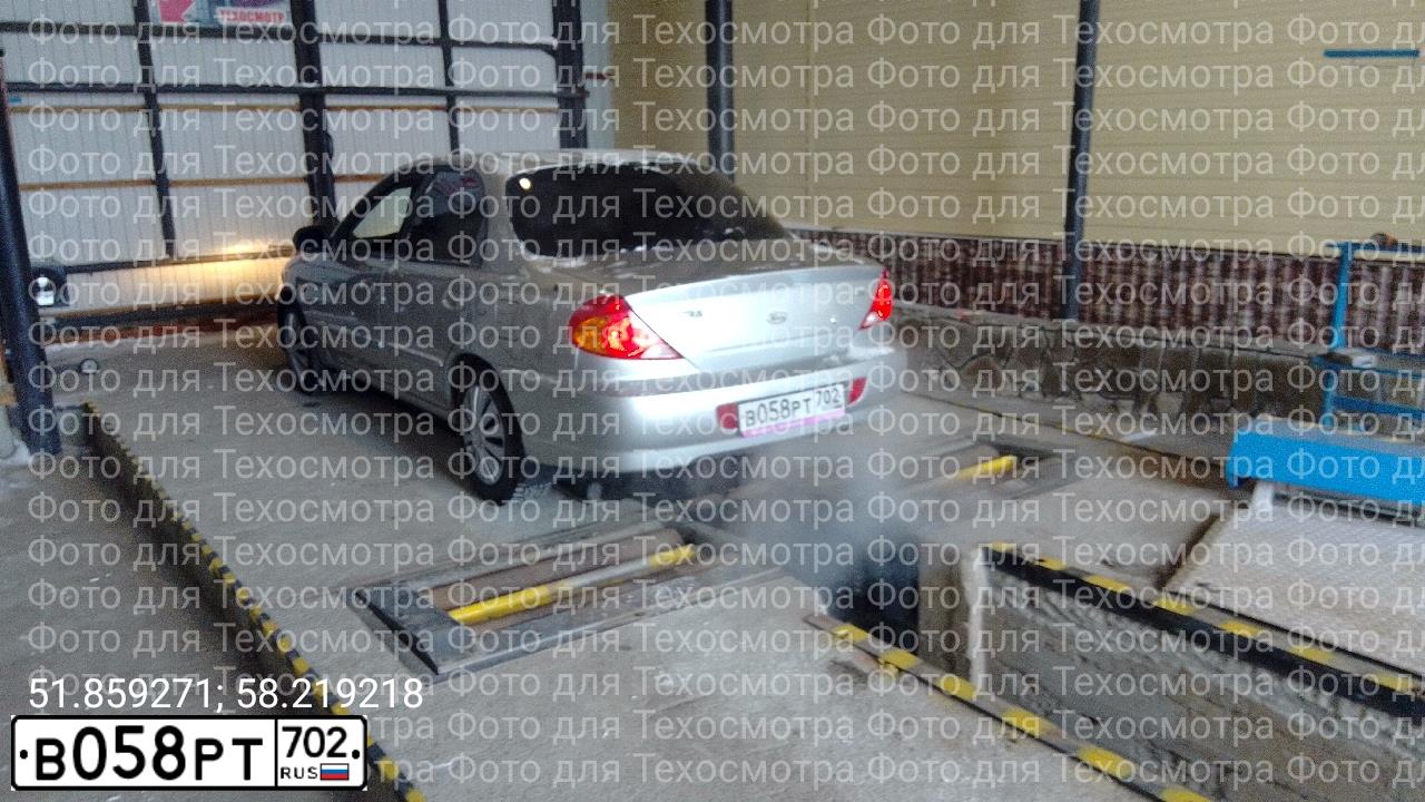 Фото автомобиля KIA SPECTRA, 2006 — госномер В058РТ702. Цвет: алмазное серебро (белый)