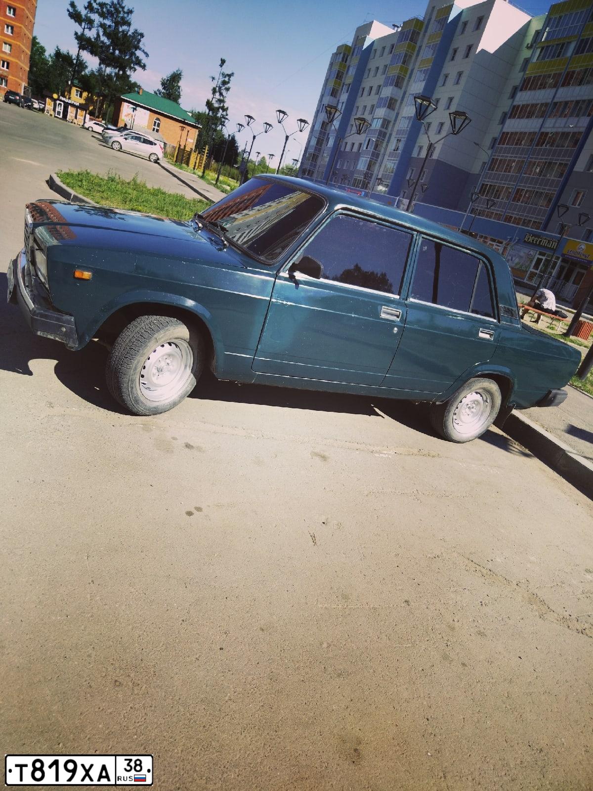 Фото автомобиля LADA 2107, 2008 — госномер Т819ХА38. Цвет: Темно-зеленый