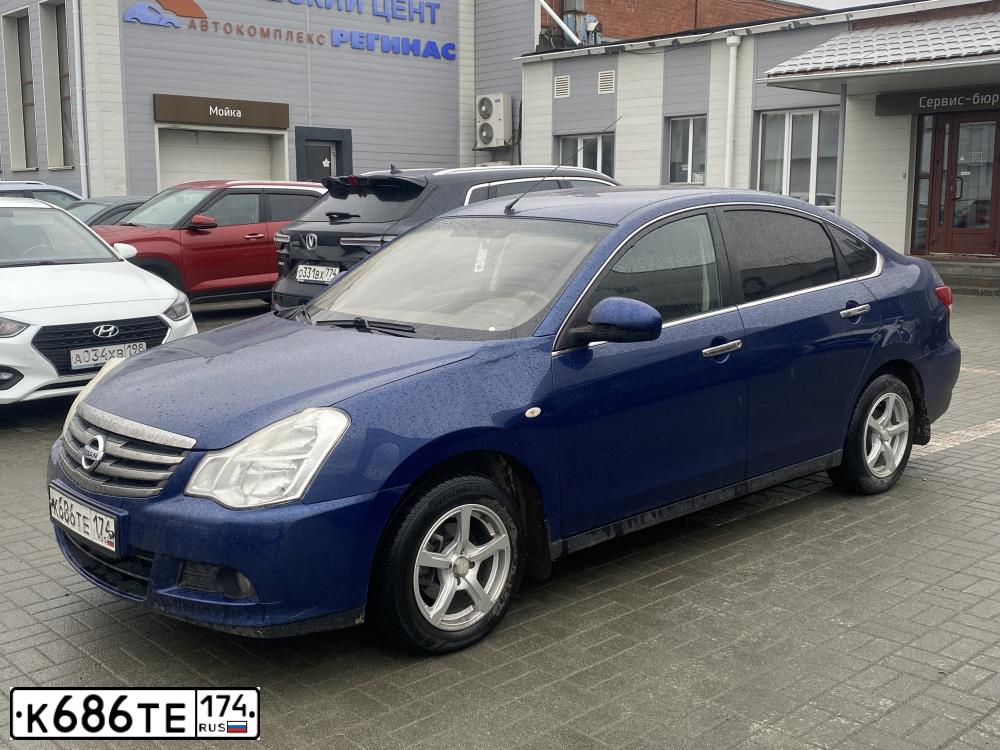 Фото автомобиля NISSAN ALMERA /AVTOVAZ/, 2015 — госномер К686ТЕ174. Цвет: СИНИЙ