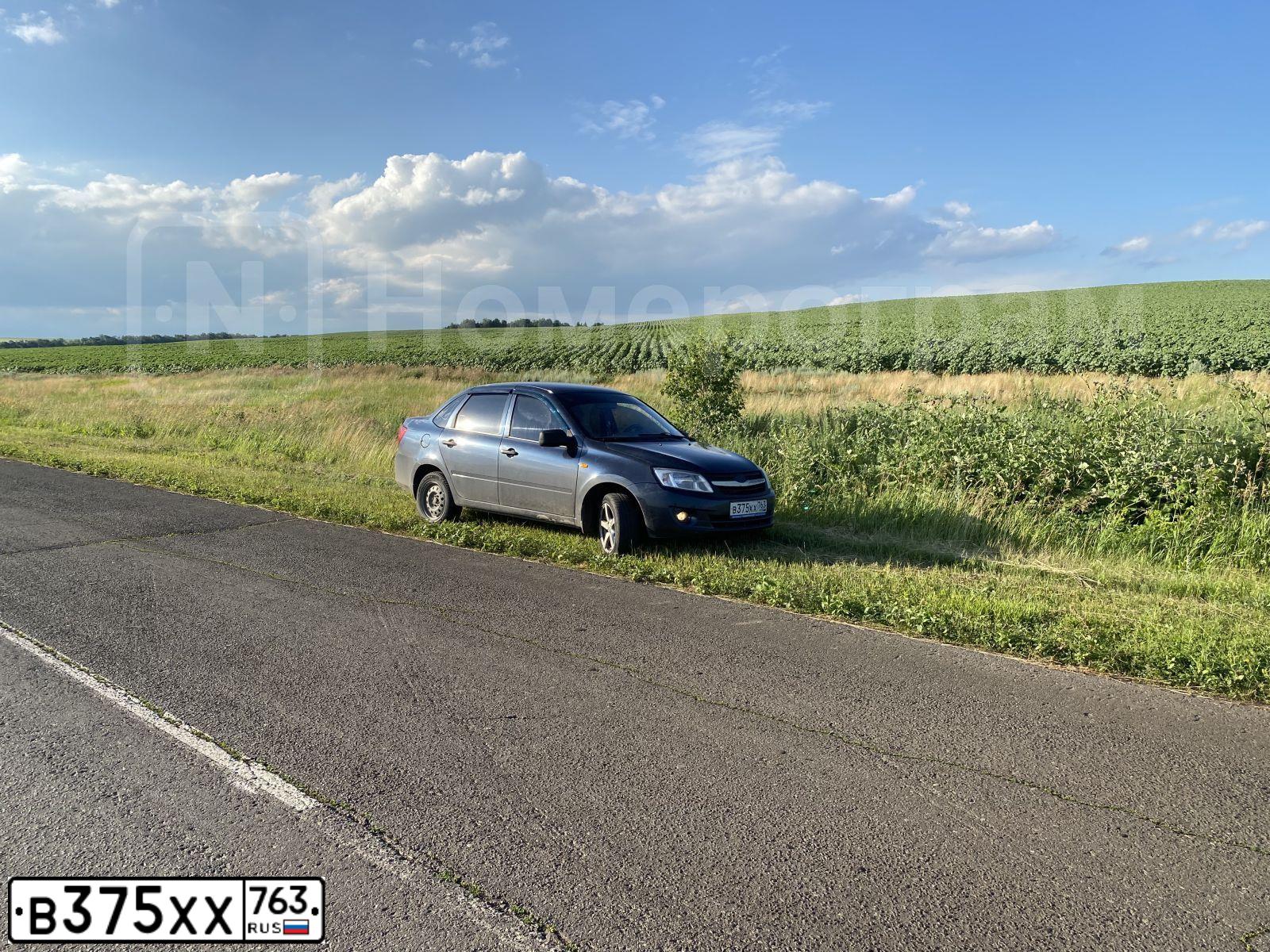 Фото автомобиля LADA 2190 GRANTA, 2011 — госномер В375ХХ763. Цвет: СЕРО-СИНИЙ