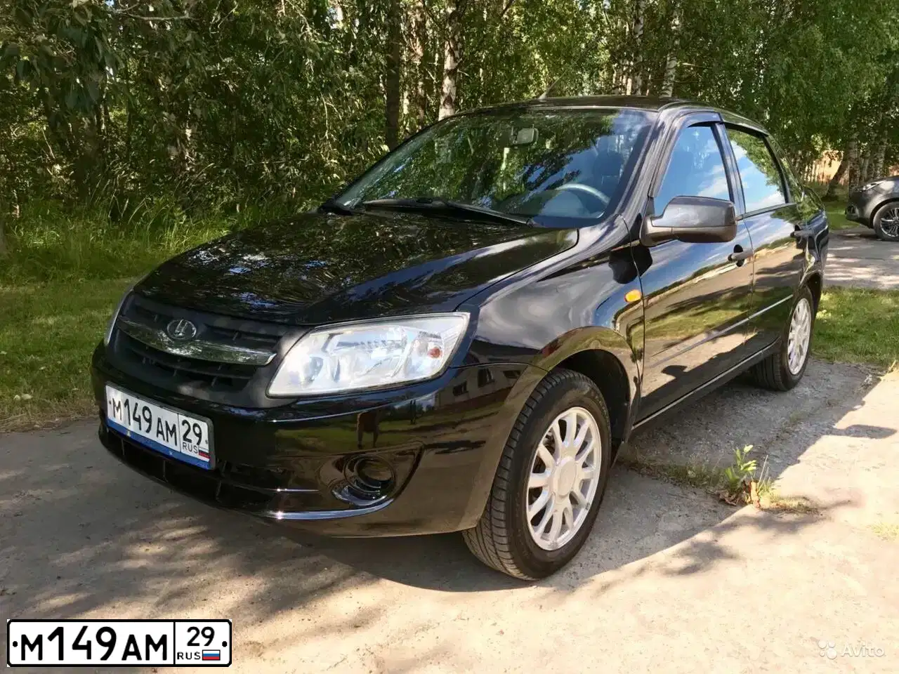 Фото автомобиля LADA 2190 GRANTA, 2014 — госномер М149АМ29. Цвет: Сине-Черный