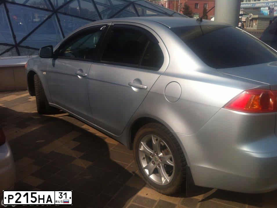Фото автомобиля MITSUBISHI LANCER, 2007 — госномер Р215НА31. Цвет: СЕРЕБРИСТЫЙ
