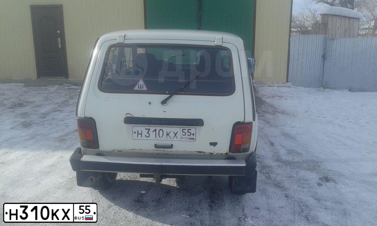 Фото автомобиля LADA 2121 NIVA, 1996 — госномер К150ОС55. Цвет: Белый