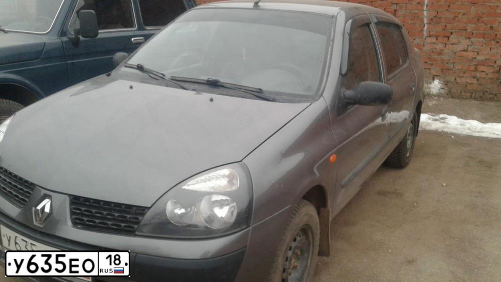 Фото автомобиля RENAULT SYMBOL, 2004 — госномер Е327УС18. Цвет: СЕРЕБРИСТО-ТЕМНО СЕРЫЙ
