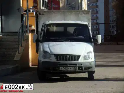 Фото автомобиля TOYOTA RAV4, 2014 — госномер Е002АК48. Цвет: Белый