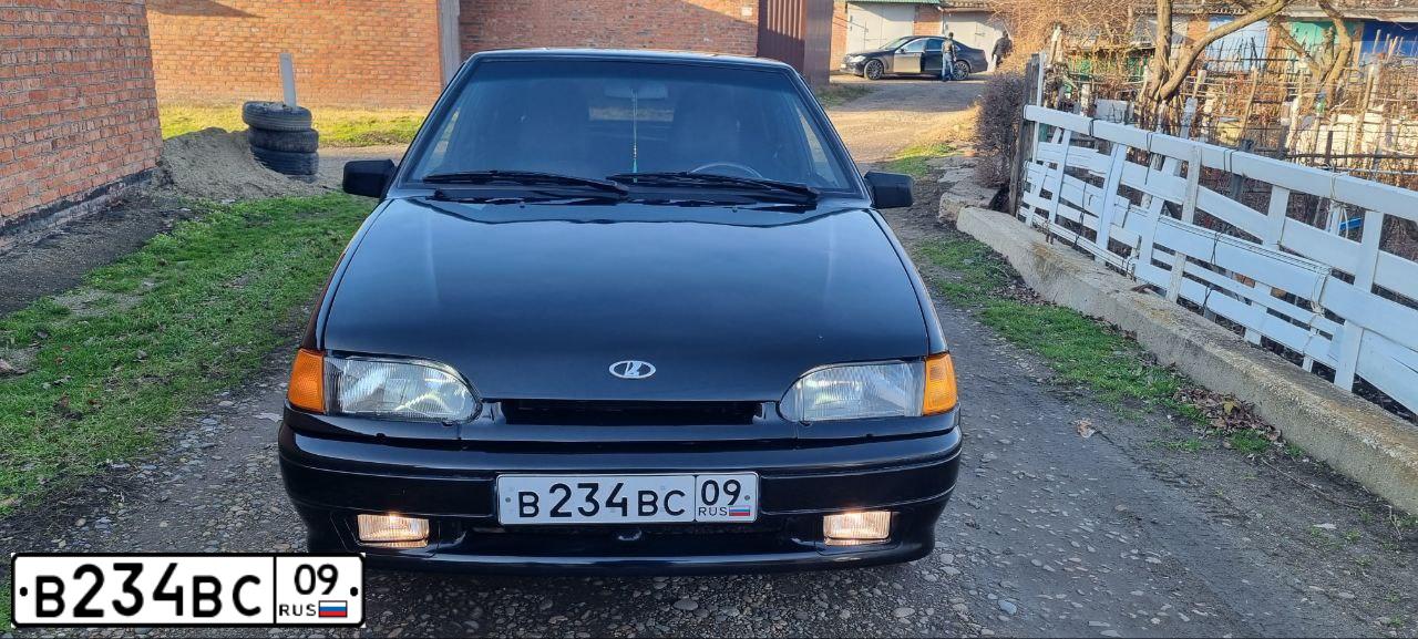 Фото автомобиля LADA 2114 SAMARA, 2012 — госномер Т009УТ26. Цвет: Сине-Черный