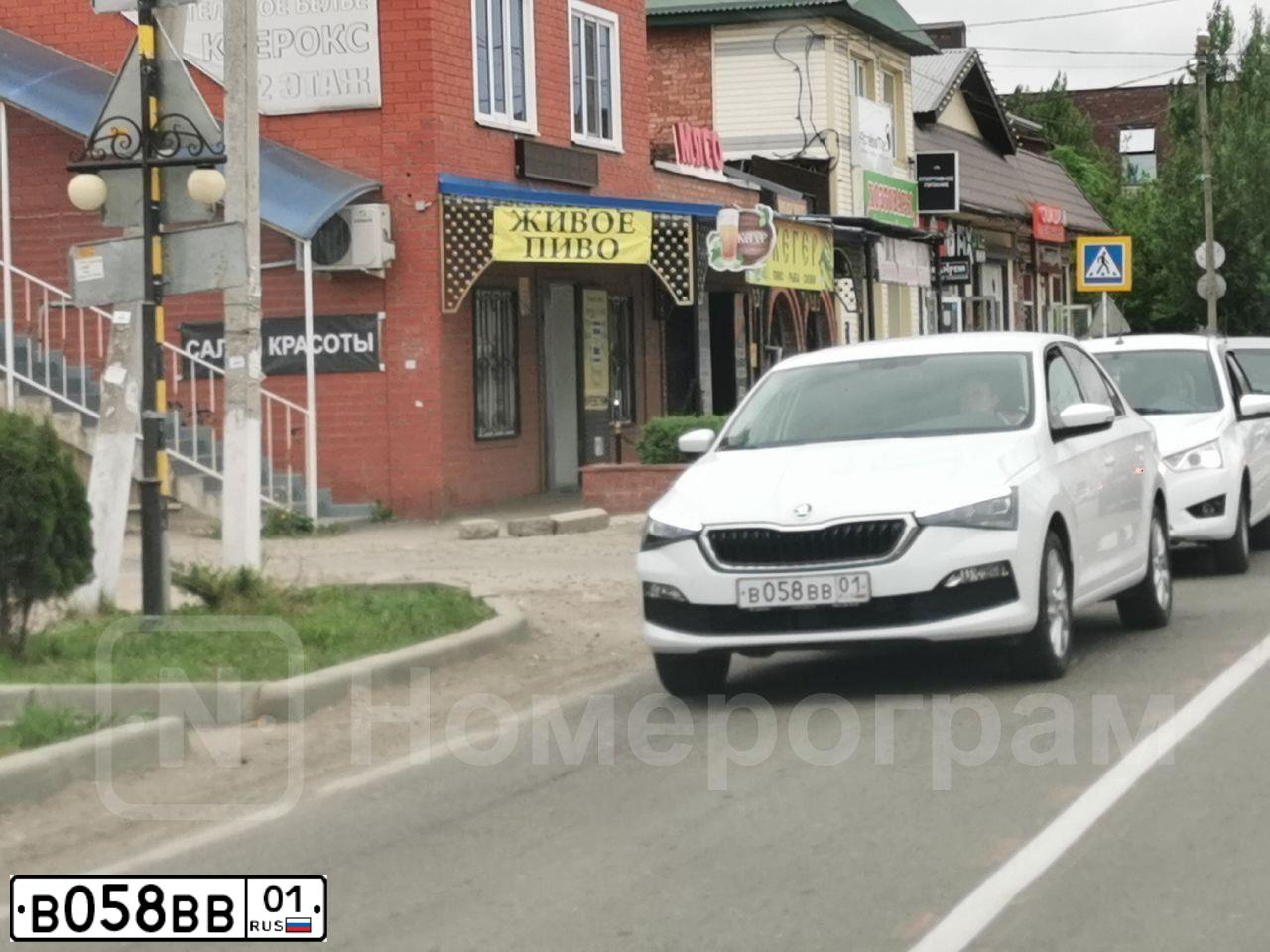 Фото автомобиля TOYOTA CAMRY, 2008 — госномер Е244ЕК01. Цвет: СЕРЫЙ