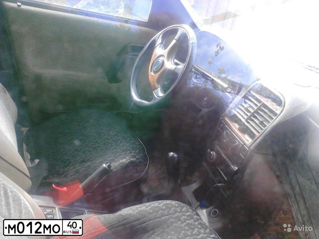 Фото автомобиля LADA 2112, 2005 — госномер В999РВ40. Цвет: БЕЖЕВЫЙ