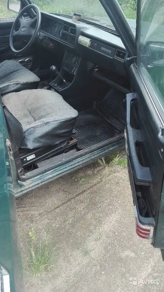 Фото автомобиля LADA 2107, 2006 — госномер Е094ВК29. Цвет: ЧЕРНО-ЗЕЛЕНЫЙ