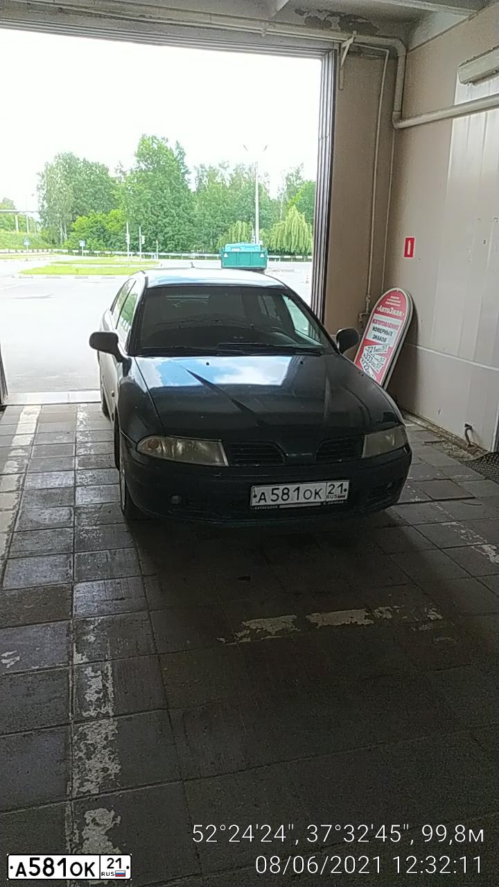 Фото автомобиля MITSUBISHI CARISMA, 1999 — госномер А581ОК21. Цвет: ЗЕЛЕНЫЙ