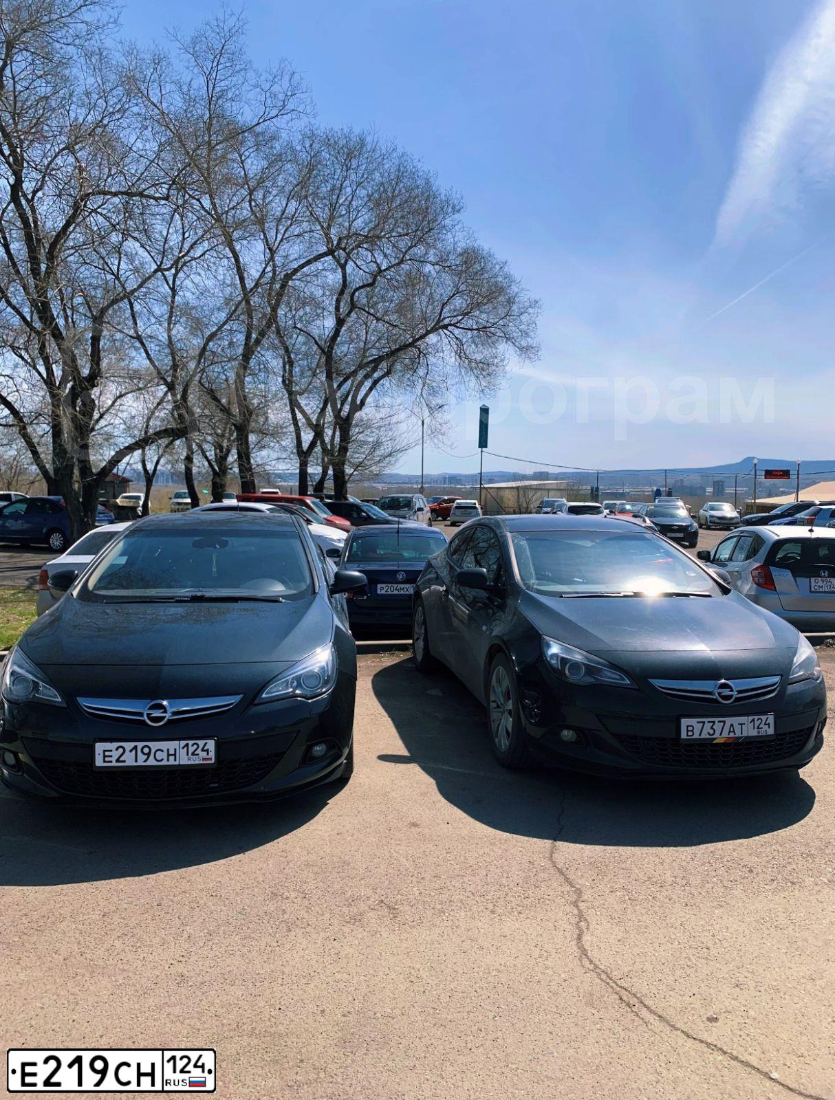 Фото автомобиля OPEL ASTRA, 2012 — госномер Е219СН124. Цвет: ЧЕРНЫЙ
