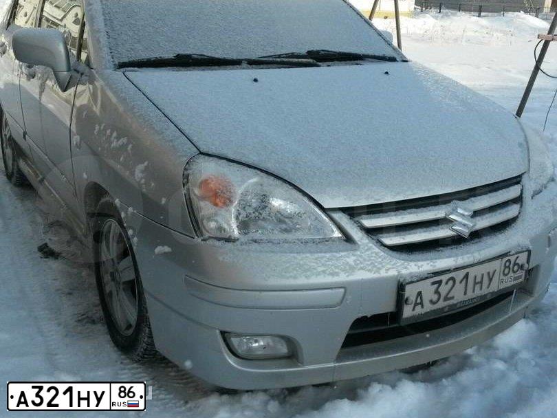 Фото автомобиля SUZUKI LIANA, 2004 — госномер С494МУ72. Цвет: СЕРЫЙ
