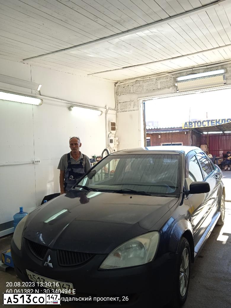 Фото автомобиля MITSUBISHI LANCER, 2003 — госномер Е233СМ60. Цвет: СЕРЫЙ