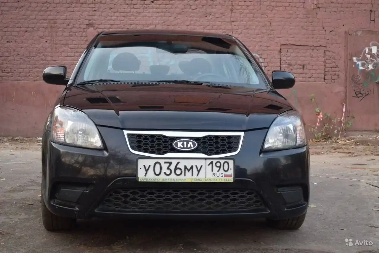 Фото автомобиля KIA RIO, 2010 — госномер О311ТС32. Цвет: ЧЕРНЫЙ