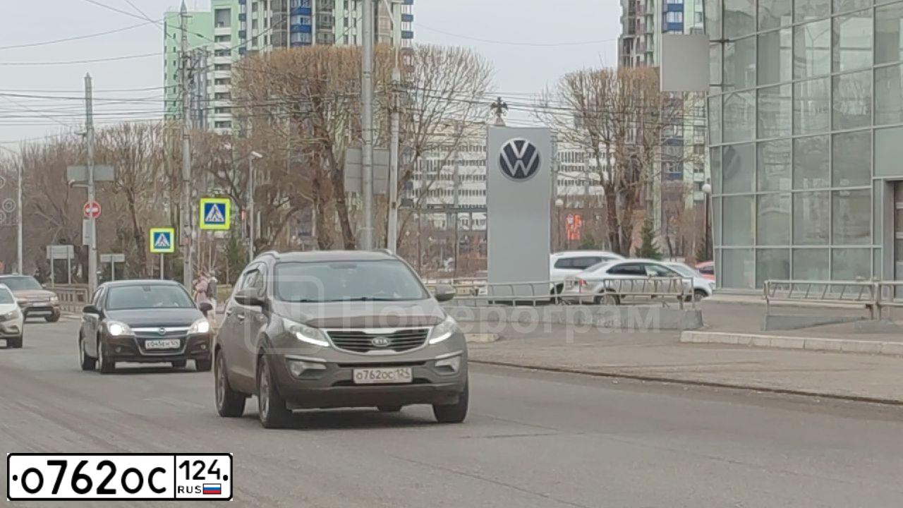 Фото автомобиля KIA SPORTAGE, 2011 — госномер О762ОС124. Цвет: Коричневый