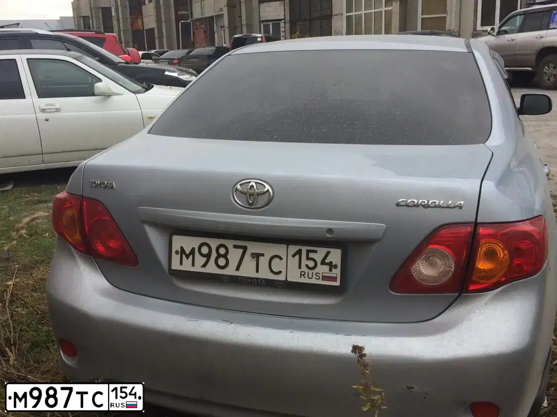 Фото автомобиля TOYOTA COROLLA, 2006 — госномер Н090ХР70. Цвет: СВЕТЛО-ГОЛУБОЙ