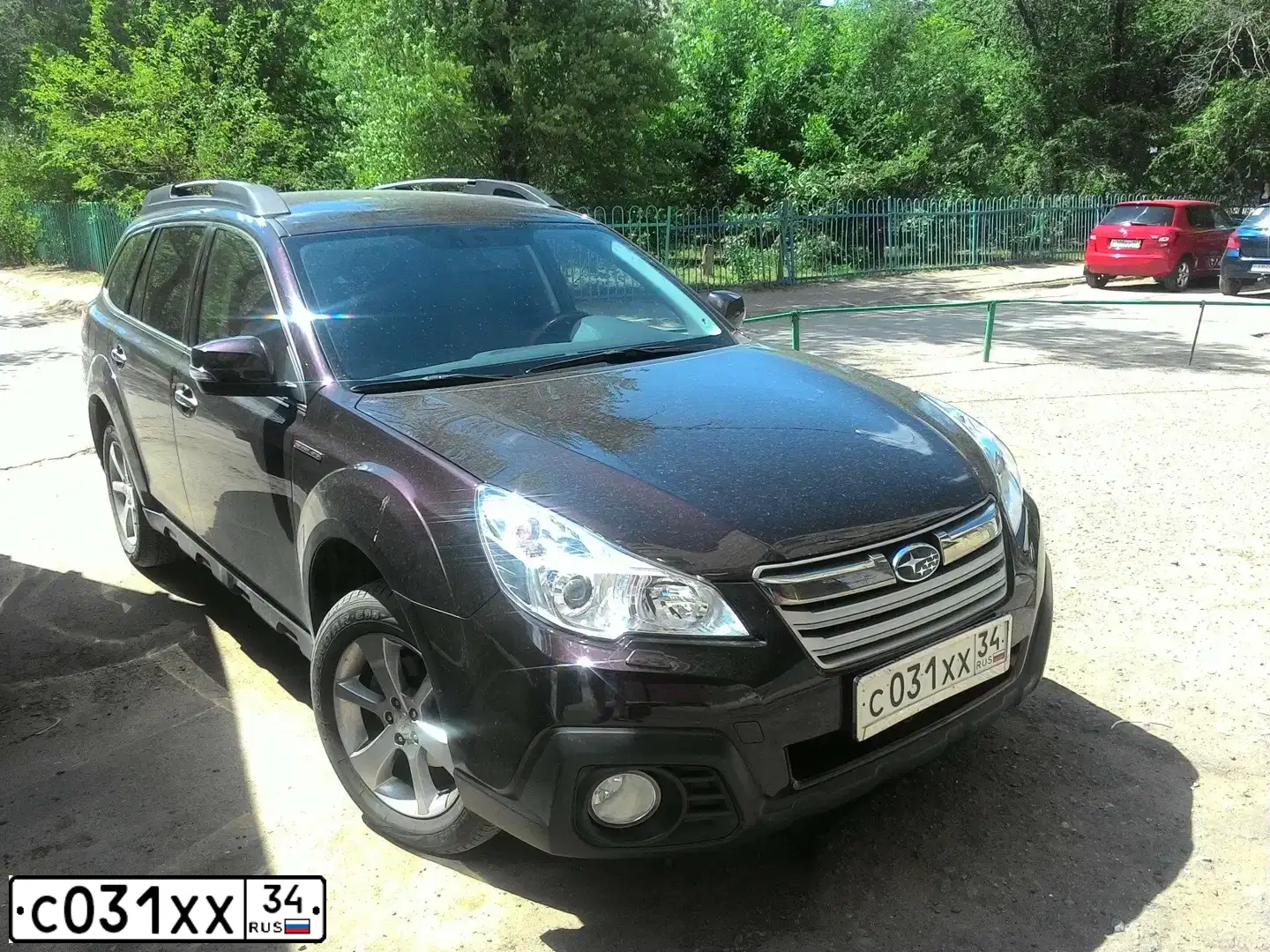 Фото автомобиля SUBARU OUTBACK, 2014 — госномер С031ХХ34. Цвет: КРАСНЫЙ