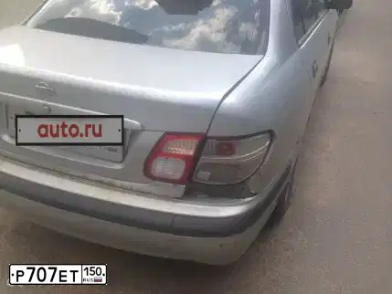Фото автомобиля NISSAN ALMERA, 2001 — госномер О827НО50. Цвет: Серебристый