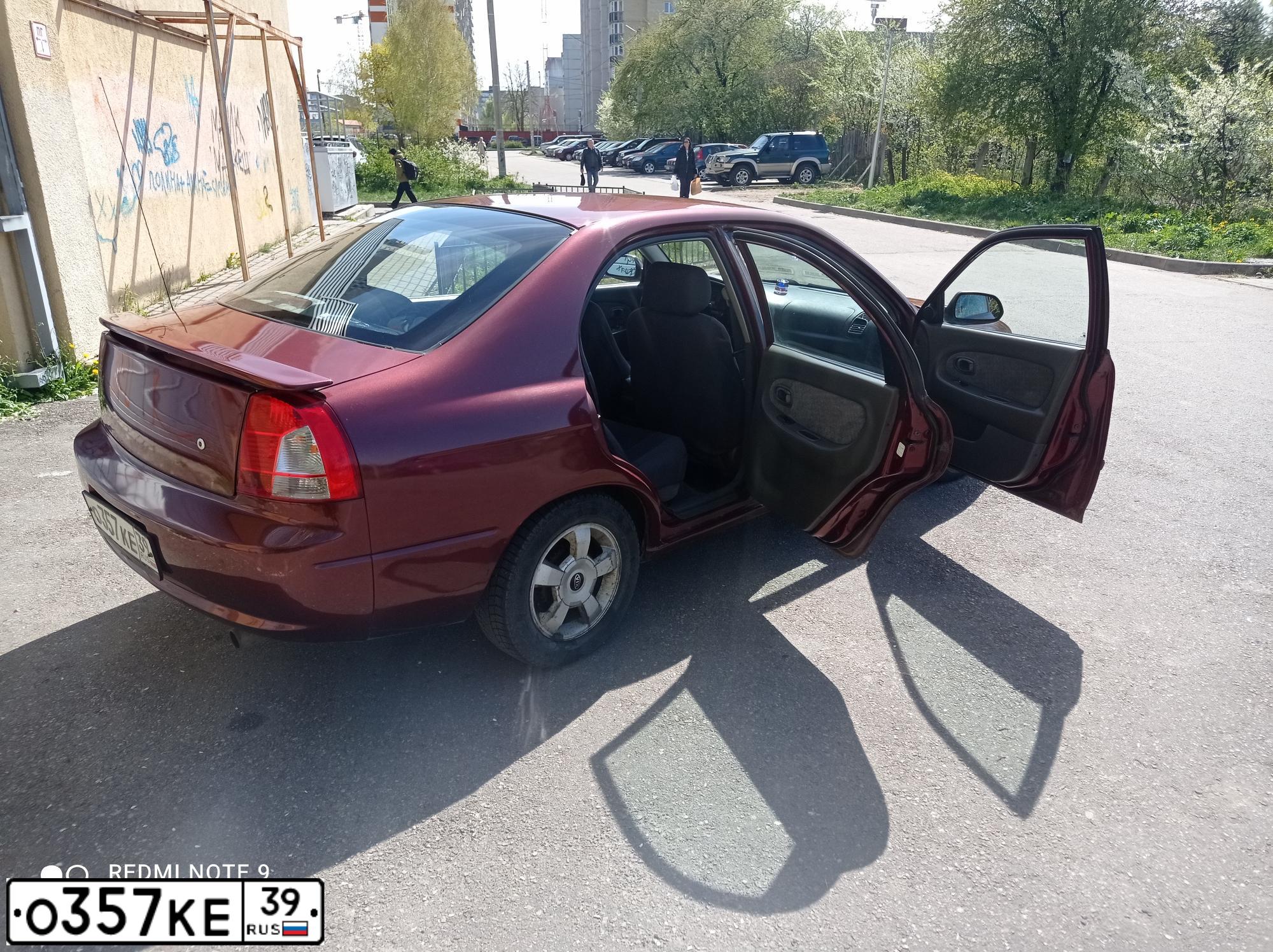 Фото автомобиля KIA SPECTRA, 2002 — госномер О357КЕ39. Цвет: Красный