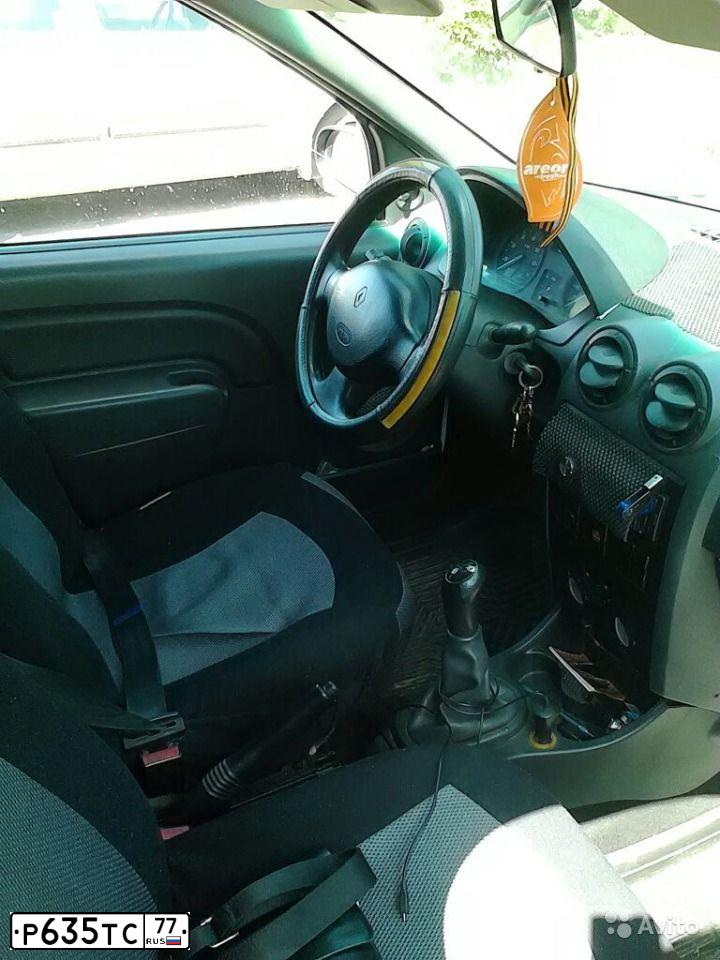 Фото автомобиля RENAULT LOGAN, 2009 — госномер Т852ЕУ51. Цвет: Белый