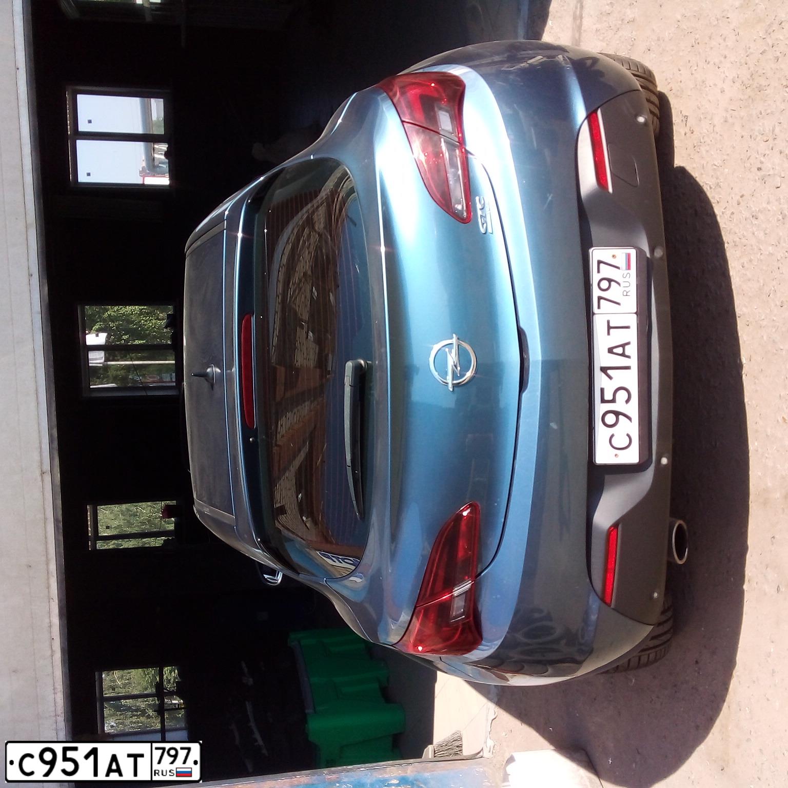 Фото автомобиля OPEL ASTRA, 2013 — госномер Т067ОУ116. Цвет: голубой