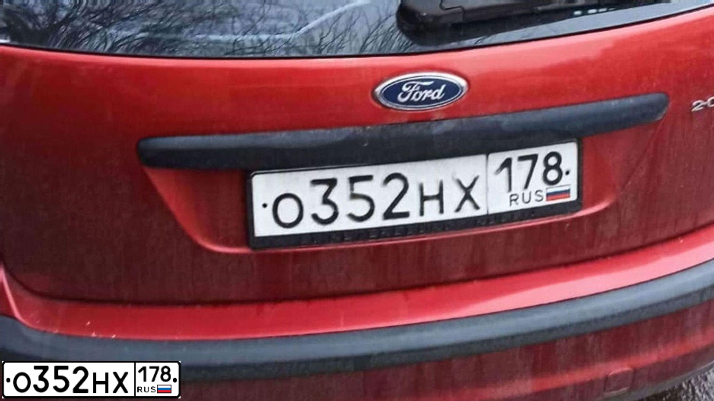 Фото автомобиля FORD FOCUS, 2005 — госномер В140УС147. Цвет: КРАСНО-ОРАНЖЕВЫЙ