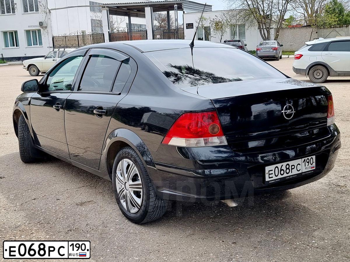 Фото автомобиля OPEL ASTRA, 2011 — госномер Е939АА11. Цвет: ЧЕРНЫЙ