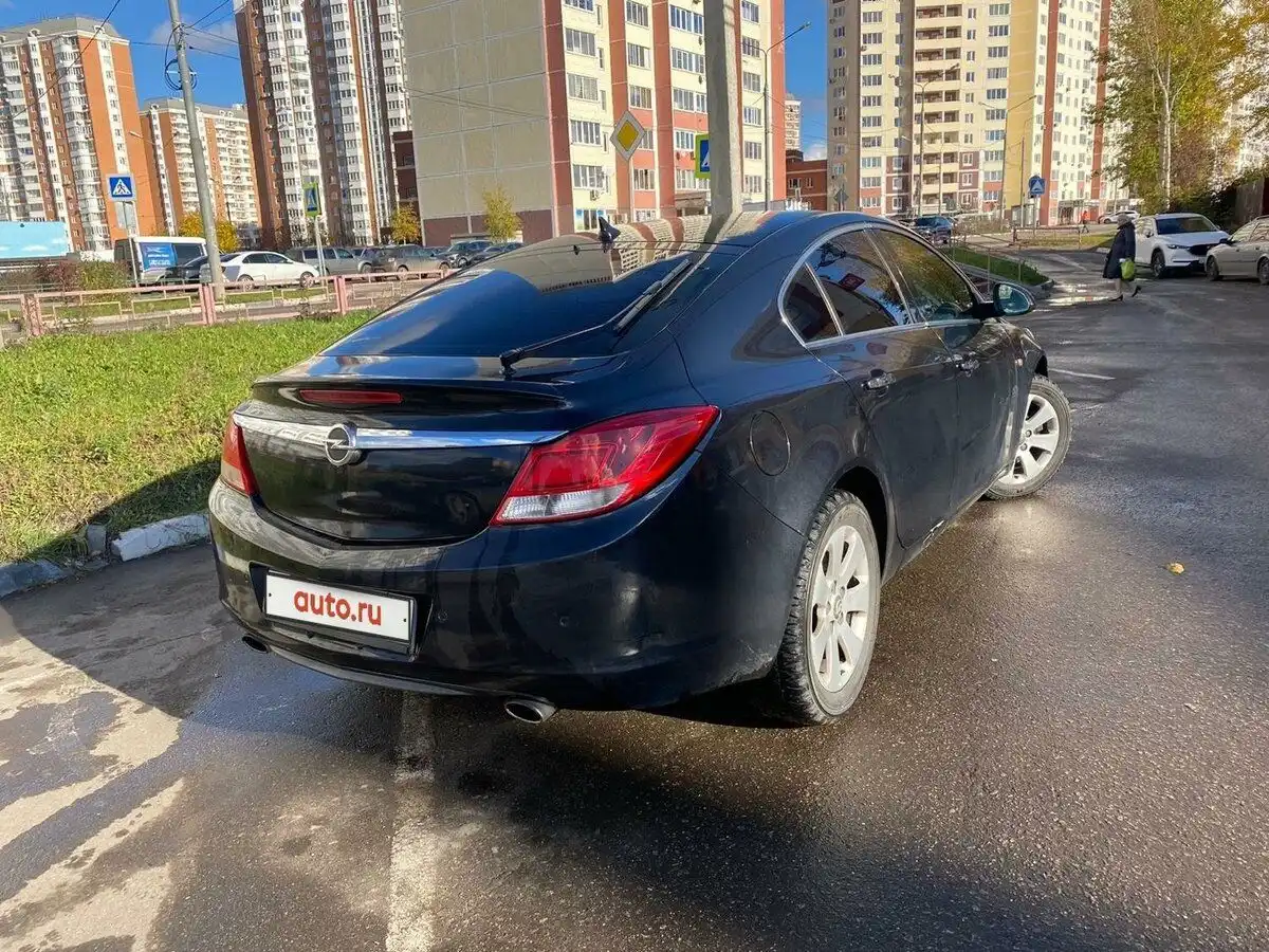 Фото автомобиля OPEL INSIGNIA, 2012 — госномер Т977СК77. Цвет: ЧЕРНЫЙ