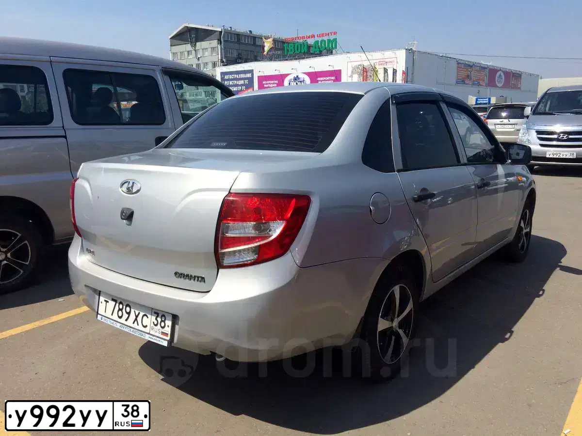 Фото автомобиля HYUNDAI GRAND STAREX, 2010 — госномер К560АС82. Цвет: СЕРЫЙ