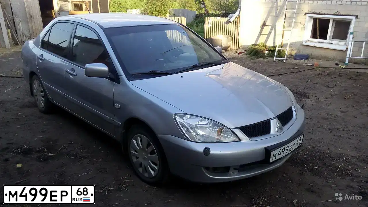 Фото автомобиля MITSUBISHI LANCER, 2009 — госномер М499ЕР68. Цвет: СЕРЕБРИСТЫЙ