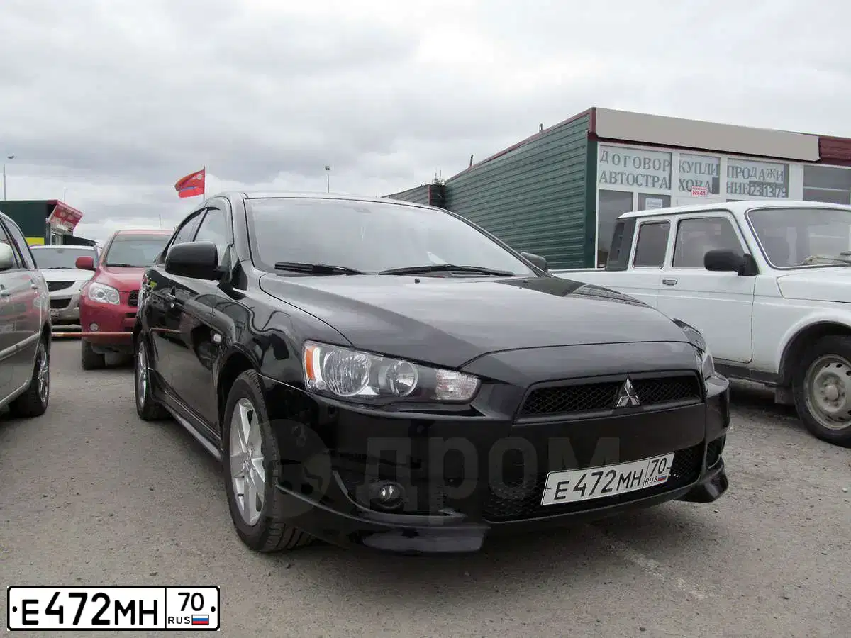 Фото автомобиля MITSUBISHI LANCER, 2008 — госномер Е472МН70. Цвет: ЧЕРНЫЙ