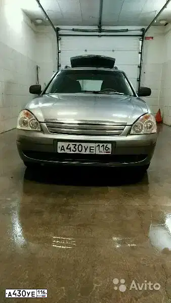 Фото автомобиля LADA 2171 PRIORA, 2010 — госномер А430УЕ116. Цвет: СРЕД СЕР -ЗЕЛЕН МЕТ