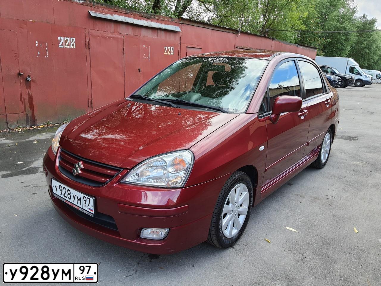 Фото автомобиля SUZUKI LIANA, 2005 — госномер Т537ТА31. Цвет: Красный