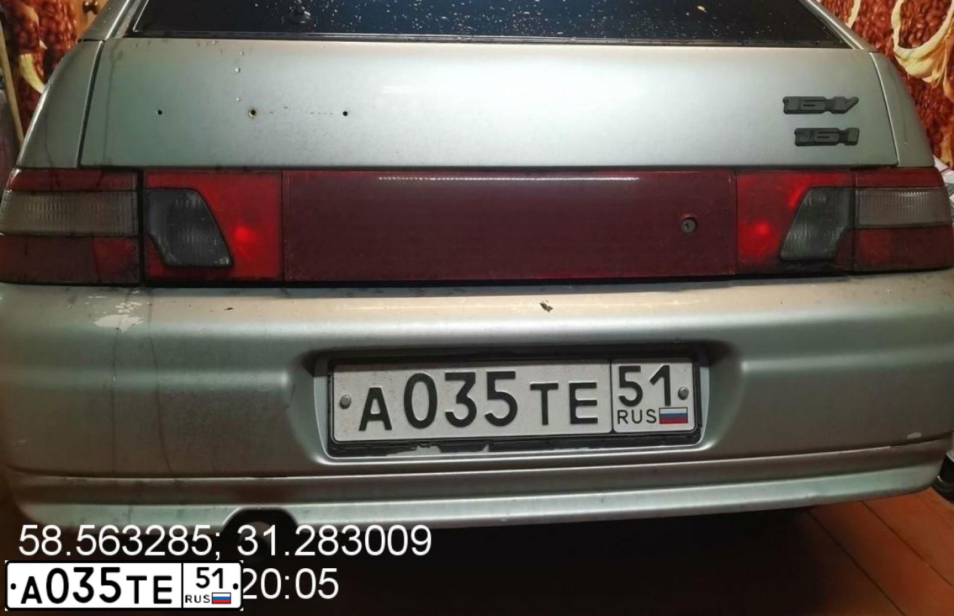 Фото автомобиля LADA 2112, 2005 — госномер А448УЕ51. Цвет: Серебристо-желто-голубой