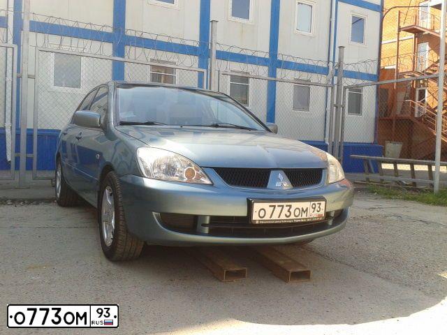 Фото автомобиля MITSUBISHI LANCER, 2007 — госномер О773ОМ93. Цвет: СВЕТЛО-СЕРО-ЗЕЛЕНЫЙ