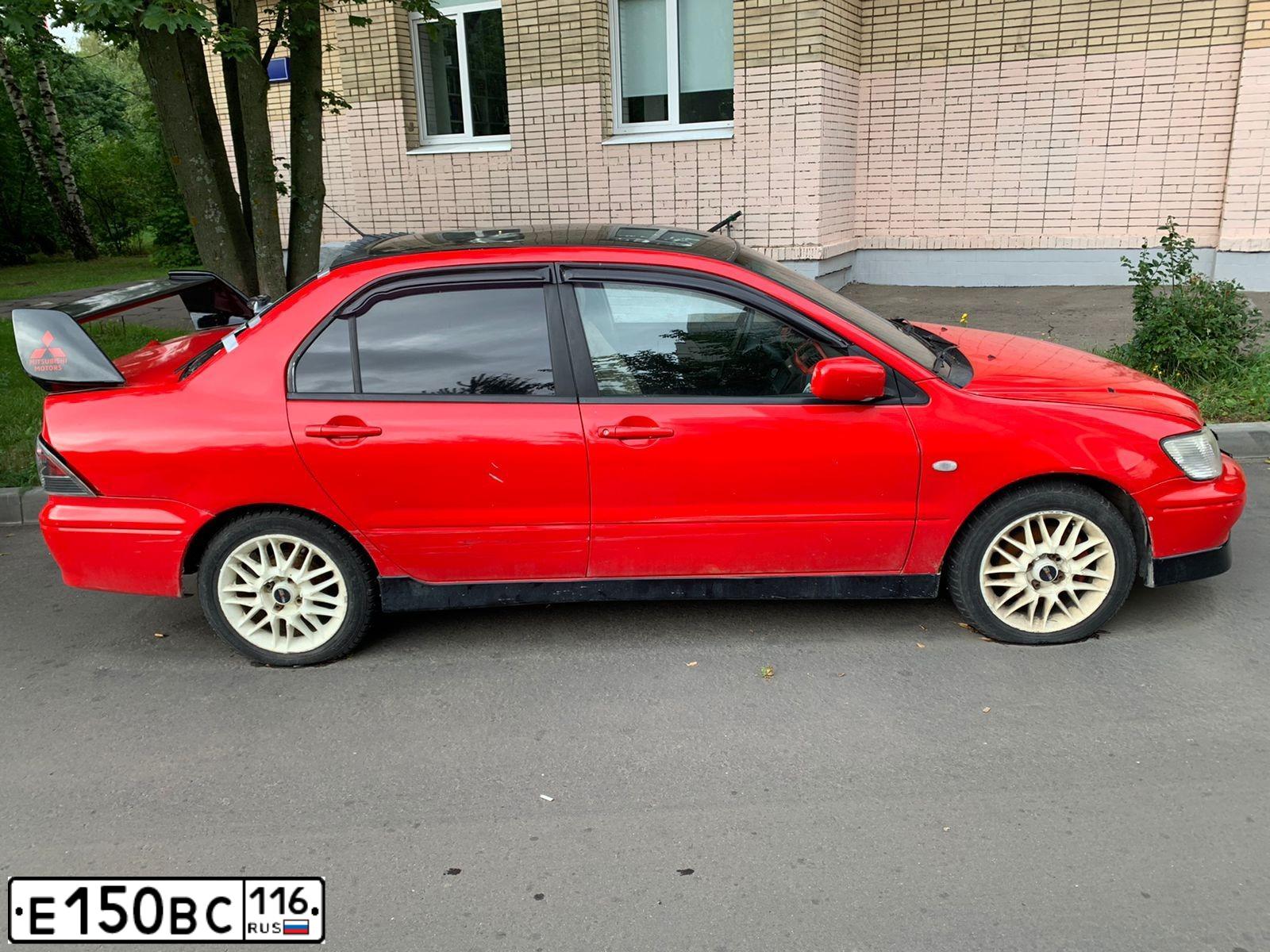 Фото автомобиля MITSUBISHI LANCER, 2002 — госномер С524НО30. Цвет: Красный