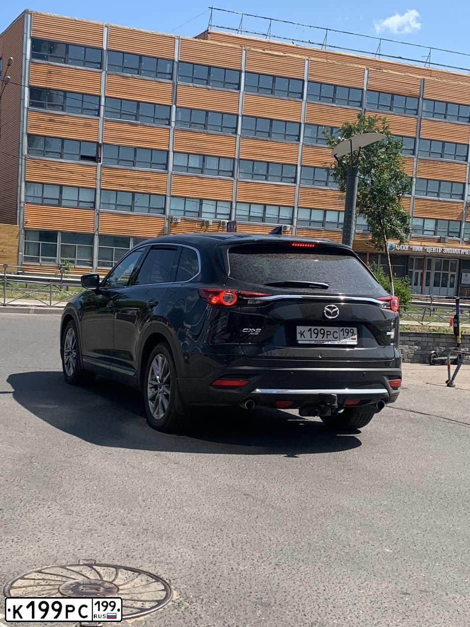 Фото автомобиля MAZDA CX-9, 2019 — госномер К199РС199. Цвет: ЧЕРНЫЙ