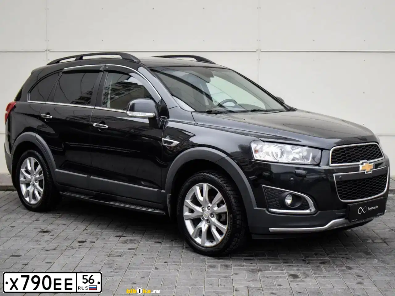 Фото автомобиля CHEVROLET CAPTIVA, 2013 — госномер Е319ЕН761. Цвет: ЧЕРНЫЙ