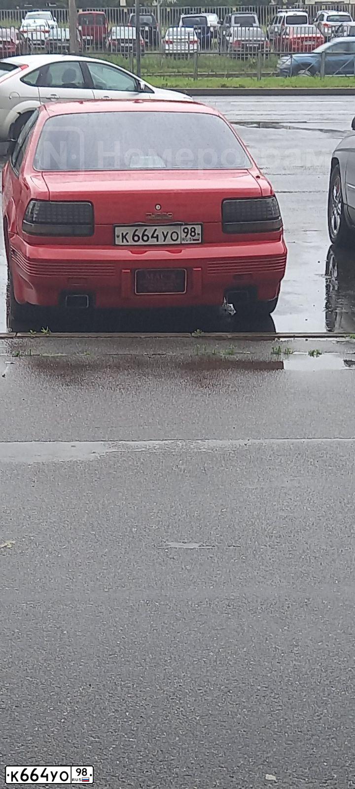 Фото автомобиля PONTIAC BONNEVILLE, 1992 — госномер М961ВЕ550. Цвет: Красный